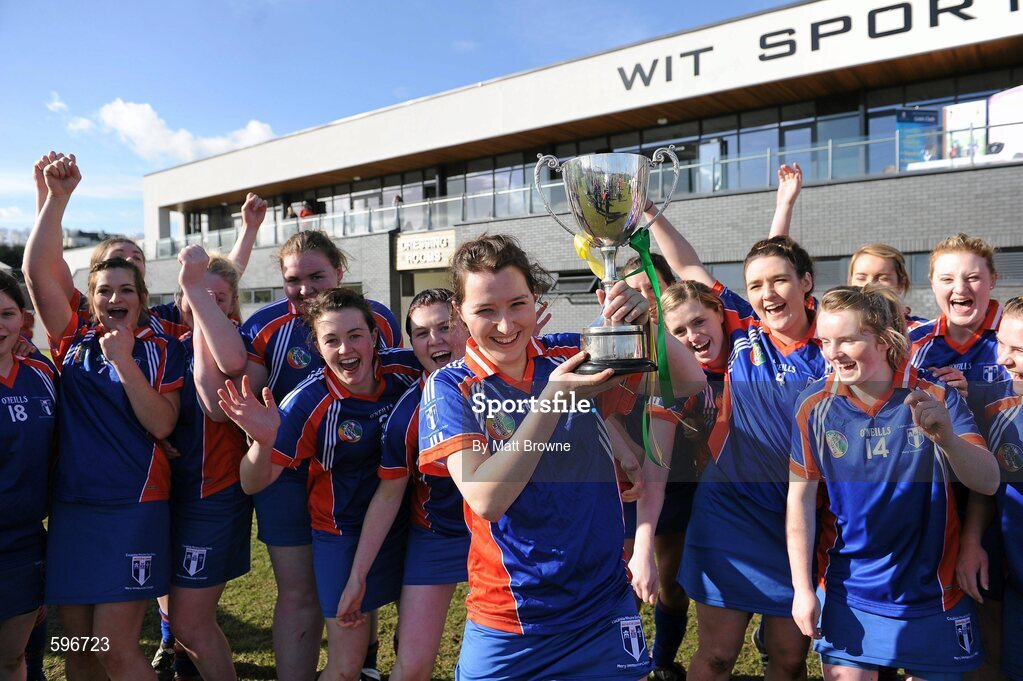 19 February 2012; Mary Immaculate Limerick captain Mairead Ryan lifts the Fr. Meachair Cup as her team-mates celebrate. 2012 Fr. Meachair Cup Final, Mary Immaculate Limerick v St. Patrick's College Drumcondra, Waterford IT, Waterford. Picture credit: Matt Browne / SPORTSFILE
