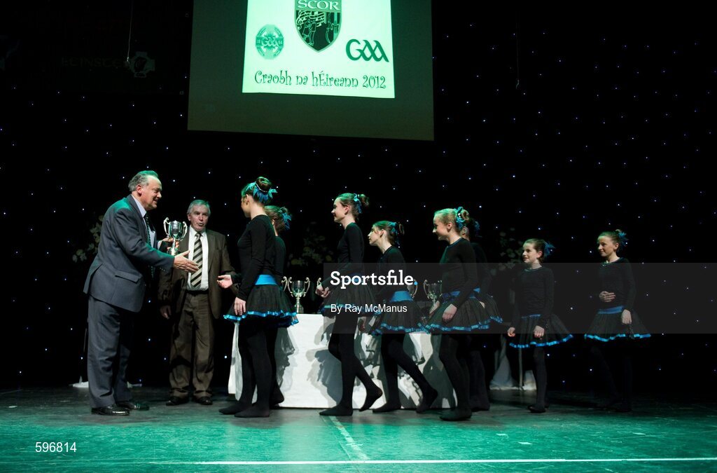 18 February 2012; The Crecora GAA Club, Co. Limerick, team of Aisling Coughlin, Orla Byrnes, Olive Wixsted, Eimear Mahon, Caoimhe Sheehan, Amy O'Connor, Fiona Hogan, and Emer Kennedy, arrive to collect the cup and medals from Paddy Naughton, Cathaoirleach, Comhairle Connacht, and Des Maguire, Cathaoirleach, Coiste Scór Naisúnta, after winning the 'Figure Dancing' competition during the All-Ireland Scór na nÓg Final 2012. Royal Theatre & Events Centre, Castlebar, Co. Mayo. Picture credit: Ray McManus / SPORTSFILE