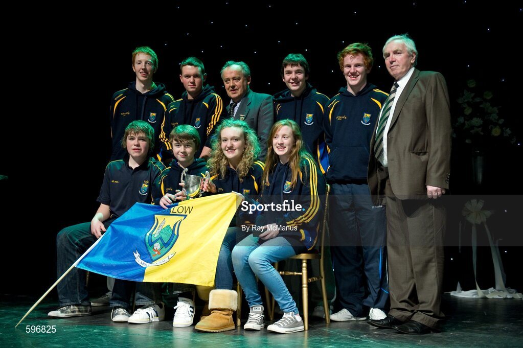 18 February 2012; The Carnew Emmetts GAA Club, Co. Wicklow, team, back row, left to right, Bob Fitzgerald, Nathan O'Connor, Paul Murphy, Conor Lambert, front row, left to right, Padraig Doran, Seamus Mulhall, Toni Doran, Anna Hennessy, with Paddy Naughton, third from left, back row, Cathaoirleach, Comhairle Connacht, and Des Maguire, right, back row, Cathaoirleach, Coiste Scór Naisúnta, after winning the 'Novelty Act' competition in the All-Ireland Scór na nÓg Final 2012. Royal Theatre & Events Centre, Castlebar, Co. Mayo. Picture credit: Ray McManus / SPORTSFILE