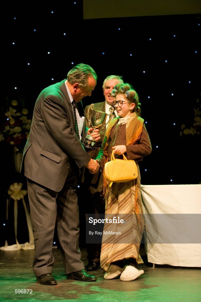 18 February 2012; Roisín Ní Bhrádaig, St Patrick's GAA Club, Palmerstown, Dublin, who won the All-Ireland Title for Recitation for Storytelling in the All-Ireland Scór na nÓg Final 2012 is presented with her prize by Paddy Naughton, Cathaoirleach, Comhairle Connacht. Royal Theatre & Events Centre, Castlebar, Co. Mayo. Picture credit: Ray McManus / SPORTSFILE