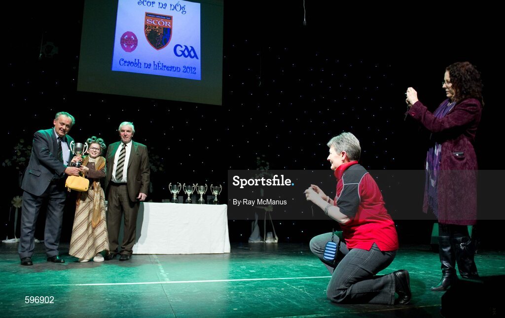 18 February 2012; Roisín Ní Bhrádaig, St Patrick's GAA Club, Palmerstown, Dublin, who won the All-Ireland Title for Recitation or Storytelling in the All-Ireland Scór na nÓg Final 2012 is presented with her prize by Paddy Naughton, Cathaoirleach, Comhairle Connacht, and Des Maguire, Cathaoirleach, Coiste Scór Naisúnta. Royal Theatre & Events Centre, Castlebar, Co. Mayo. Picture credit: Ray McManus / SPORTSFILE