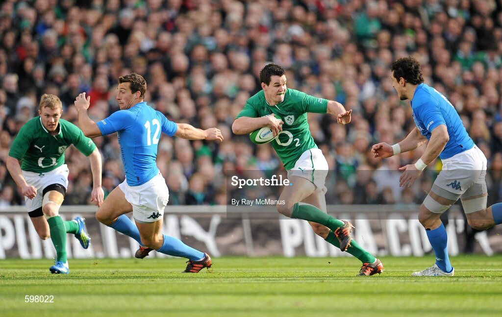 25 February 2012; Jonathan Sexton, Ireland, slips past Alberto Sgarbi, 12, and Alberto Sgarbi, Italy. RBS Six Nations Rugby Championship, Ireland v Italy, Aviva Stadium, Lansdowne Road, Dublin. Picture credit: Ray McManus / SPORTSFILE