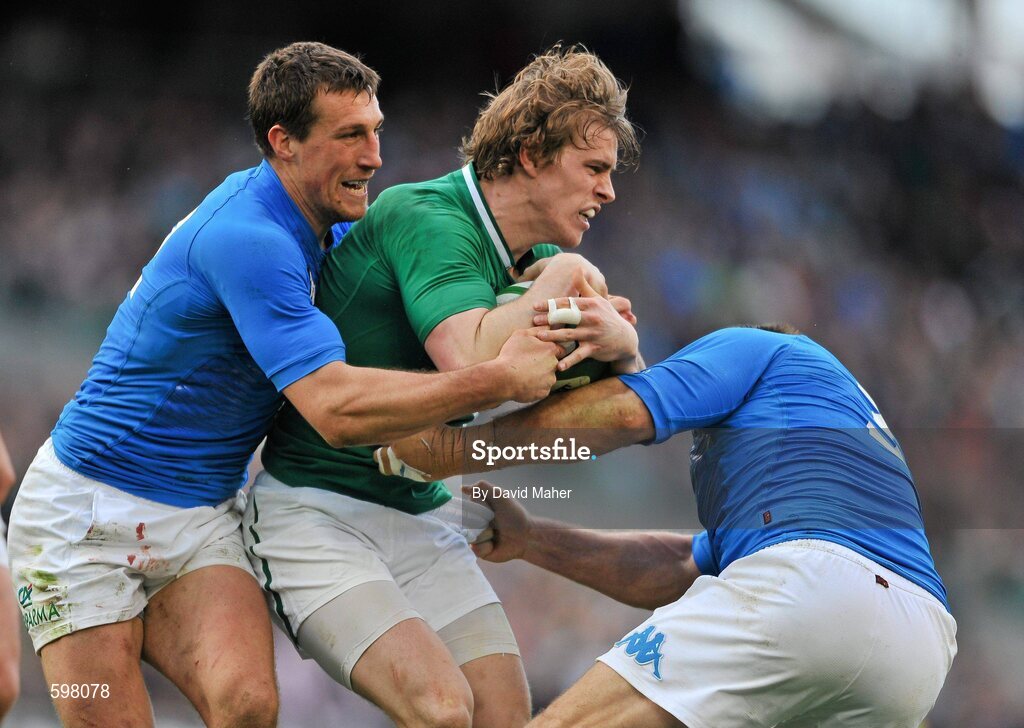 25 February 2012; Andrew Trimble, Ireland, is tackled by Alberto Sgarbi, left, and Lorenzo Cittadini, Italy. RBS Six Nations Rugby Championship, Ireland v Italy, Aviva Stadium, Lansdowne Road, Dublin. Picture credit: David Maher / SPORTSFILE