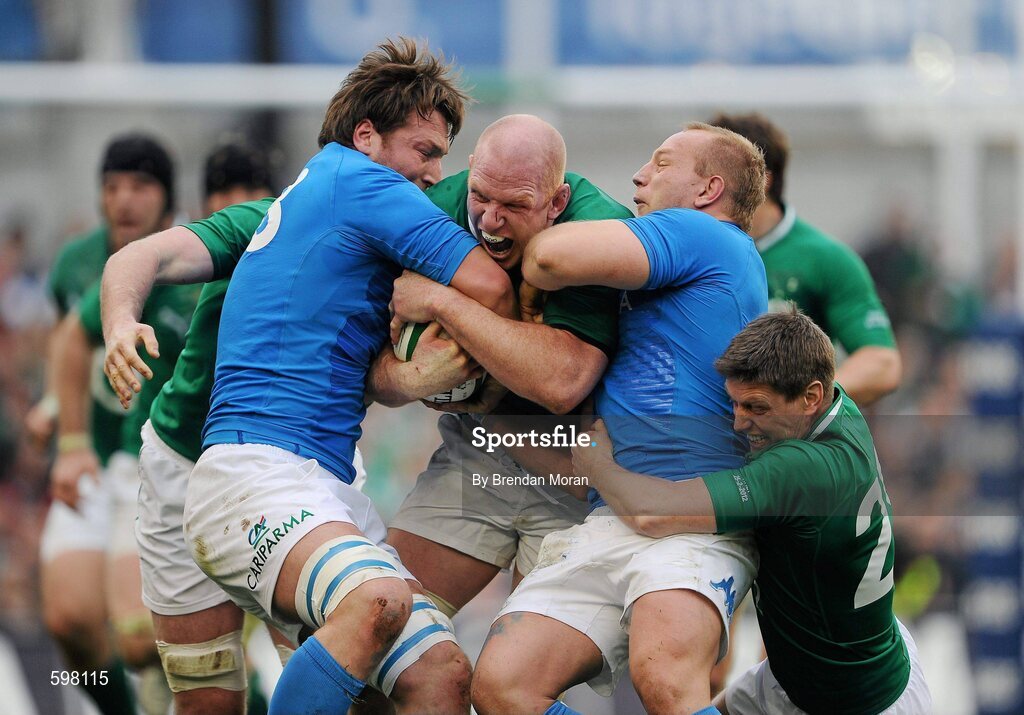 25 February 2012; Paul O'Connell, Ireland, supported by Ronan O'Gara, right, is tackled by Antonio Pavanello, left, and Leonardo Ghiraldini, Italy. RBS Six Nations Rugby Championship, Ireland v Italy, Aviva Stadium, Lansdowne Road, Dublin. Picture credit: Brendan Moran / SPORTSFILE