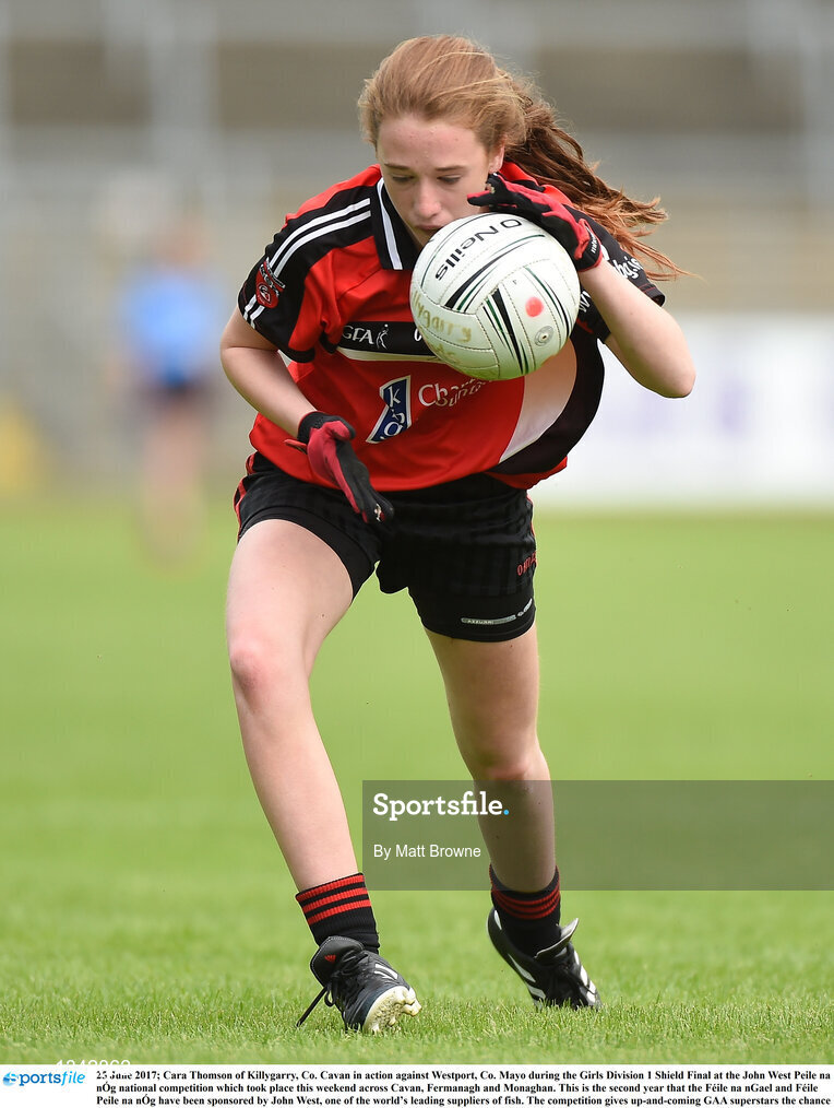 25 June 2017; Cara Thomson of Killygarry, Co. Cavan in action against Westport, Co. Mayo during the Girls Division 1 Shield Final at the John West Peile na nÓg national competition which took place this weekend across Cavan, Fermanagh and Monaghan. This is the second year that the Féile na nGael and Féile Peile na nÓg have been sponsored by John West, one of the world’s leading suppliers of fish. The competition gives up-and-coming GAA superstars the chance to participate and play in their respective Féile tournament, at a level which suits their age, skills and strengths. Photo by Matt Browne/Sportsfile