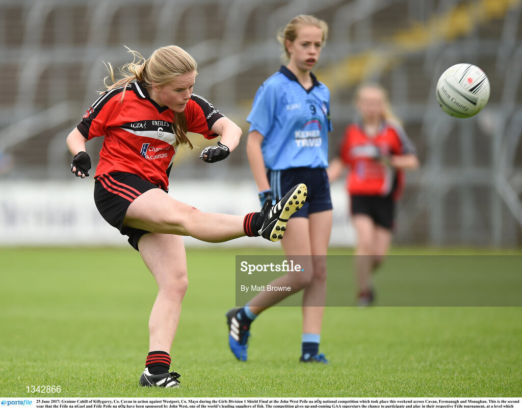 25 June 2017; Grainne Cahill of Killygarry, Co. Cavan in action against Westport, Co. Mayo during the Girls Division 1 Shield Final at the John West Peile na nÓg national competition which took place this weekend across Cavan, Fermanagh and Monaghan. This is the second year that the Féile na nGael and Féile Peile na nÓg have been sponsored by John West, one of the world’s leading suppliers of fish. The competition gives up-and-coming GAA superstars the chance to participate and play in their respective Féile tournament, at a level which suits their age, skills and strengths. Photo by Matt Browne/Sportsfile