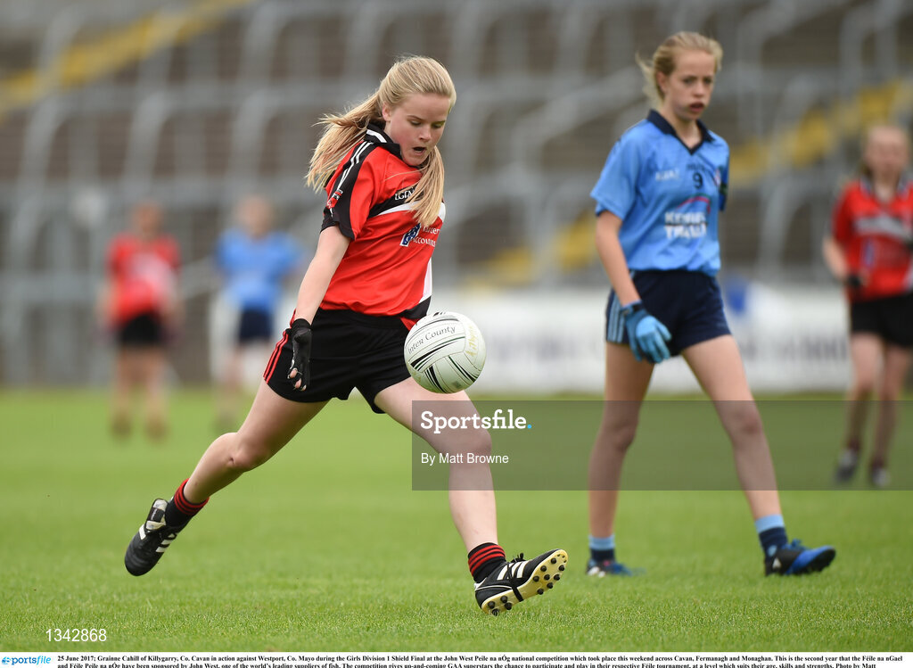 25 June 2017; Grainne Cahill of Killygarry, Co. Cavan in action against Westport, Co. Mayo during the Girls Division 1 Shield Final at the John West Peile na nÓg national competition which took place this weekend across Cavan, Fermanagh and Monaghan. This is the second year that the Féile na nGael and Féile Peile na nÓg have been sponsored by John West, one of the world’s leading suppliers of fish. The competition gives up-and-coming GAA superstars the chance to participate and play in their respective Féile tournament, at a level which suits their age, skills and strengths. Photo by Matt Browne/Sportsfile