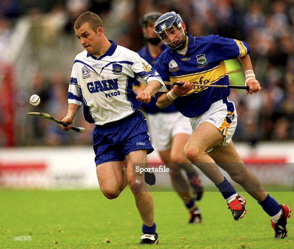 30 June 2002; Eoin McGrath, Waterford, in action against Paul Kelly, Tipperary. Waterford v Tipperary, Guinness Munster Hurling Final, Pairc Ui Chaoimh, Cork. Picture credit; Brendan Moran / SPORTSFILE