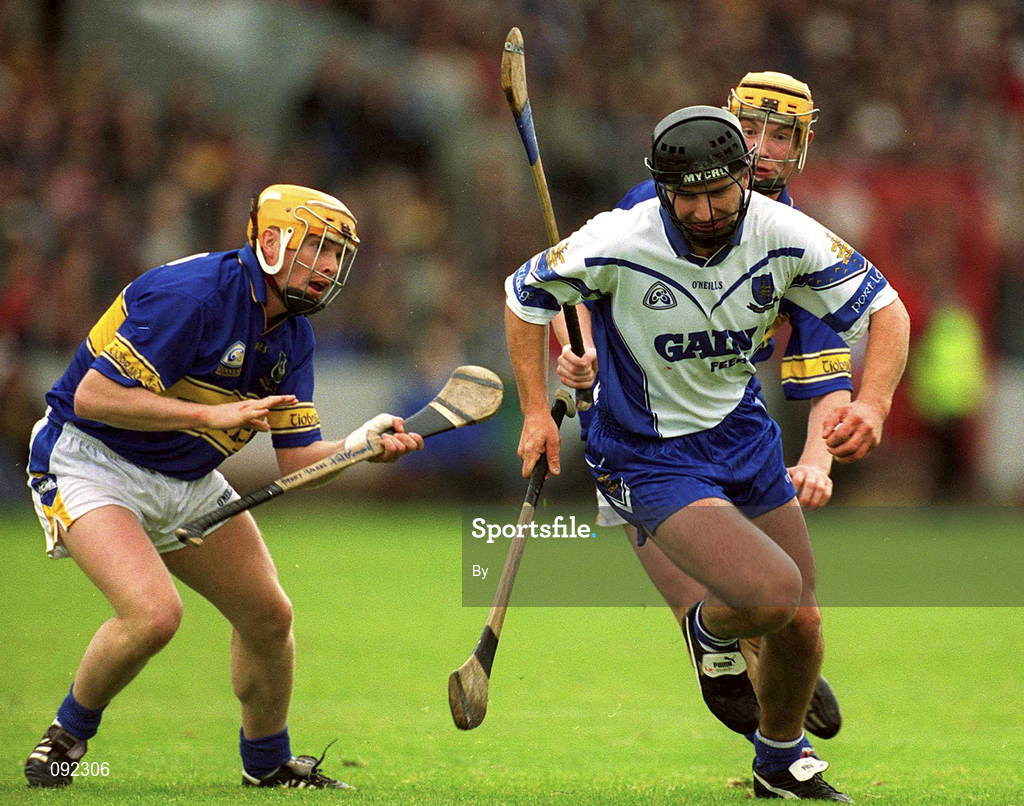 30 June 2002; Seamus Prendergast, Waterford, in action against Tipperary's Paul Ormonde, left, and Eamonn Corcoran. Waterford v Tipperary, Guinness Munster Hurling Final, Pairc Ui Chaoimh, Cork. Picture credit; Brendan Moran / SPORTSFILE