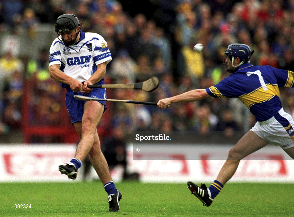 30 June 2002; Seamus Prendergast, Waterford, in action against Paul Kelly, Tipperary. Waterford v Tipperary, Guinness Munster Hurling Final, Pairc Ui Chaoimh, Cork. Picture credit; Ray McManus / SPORTSFILE