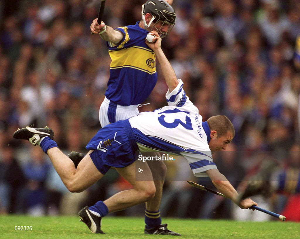 30 June 2002; Eoin McGrath, Waterford, in action against Thomas Costello, Tipperary. Waterford v Tipperary, Guinness Munster Hurling Final, Pairc Ui Chaoimh, Cork. Picture credit; Ray McManus / SPORTSFILE