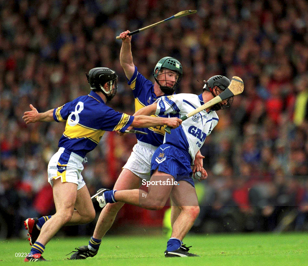 30 June 2002; Seamus Prendergast, Waterford, in action against Tipperary's Thomas Dunne (8) and David Kennedy. Waterford v Tipperary, Guinness Munster Hurling Final, Pairc Ui Chaoimh, Cork. Picture credit; Ray McManus / SPORTSFILE