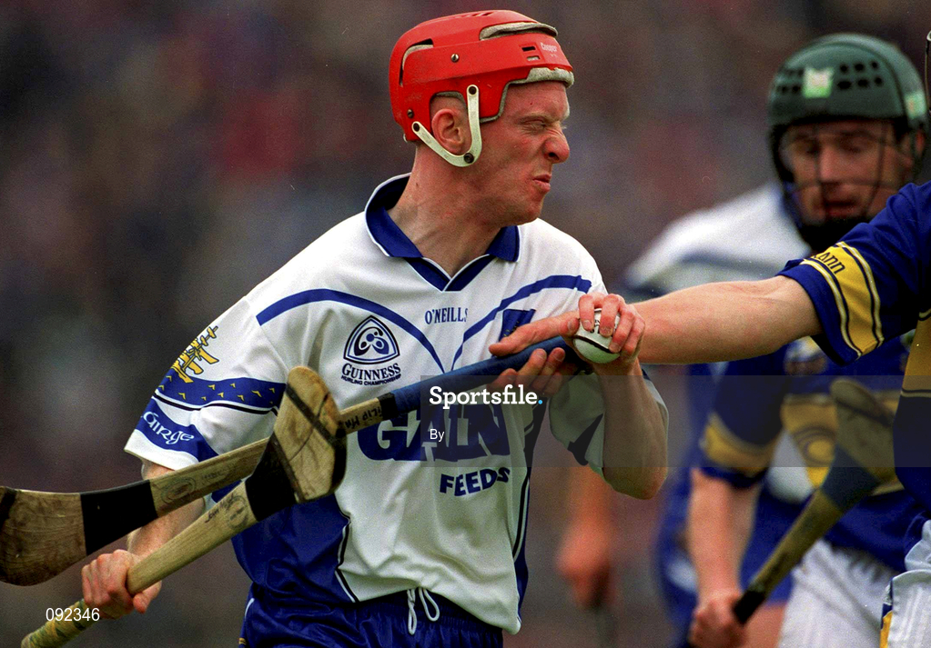 30 June 2002; John Mullane, Waterford, in action against Thomas Dunne, Tipperary. Waterford v Tipperary, Guinness Munster Hurling Final, Pairc Ui Chaoimh, Cork. Picture credit; Ray McManus / SPORTSFILE