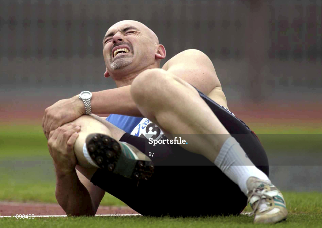 13 July 2002; Terry McHugh holds his knee after collapsing while on his second throw during the Men's Javelin event, where he was going for a world record 19th consecutive victory. AAI National Track and Field Championships, Morton Stadium, Santry, Dublin. Athletics. Picture credit; Brendan Moran / SPORTSFILE *EDI*