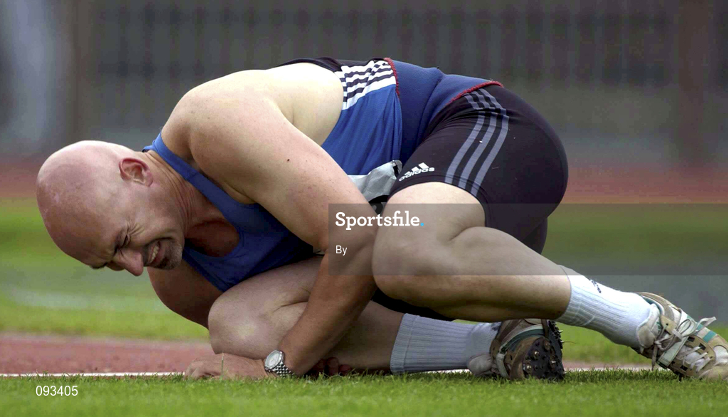 13 July 2002; Terry McHugh holds his knee after collapsing while on his second throw during the Men's Javelin event, where he was going for a world record 19th consecutive victory. AAI National Track and Field Championships, Morton Stadium, Santry, Dublin. Athletics. Picture credit; Brendan Moran / SPORTSFILE *EDI*