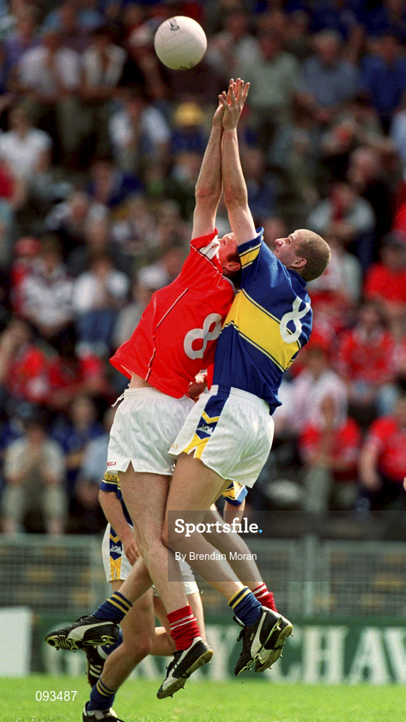 14 July 2002; Nicholas Murphy of Cork is tackled by Kevin Mulryan of Tipperary during the Bank of Ireland Munster Senior Football Final match between Tipperary and Cork at Semple Stadium in Thurles, Tipperary. Photo by Brendan Moran/Sportsfile