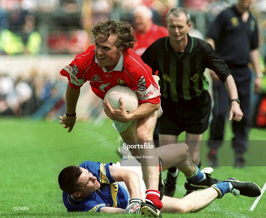 14 July 2002; Alan Cronin of Cork gets away from Sean Maher of Tipperar during the Bank of Ireland Munster Senior Football Final match between Tipperary and Cork at Semple Stadium in Thurles, Tipperary. Photo by Brendan Moran/Sportsfile