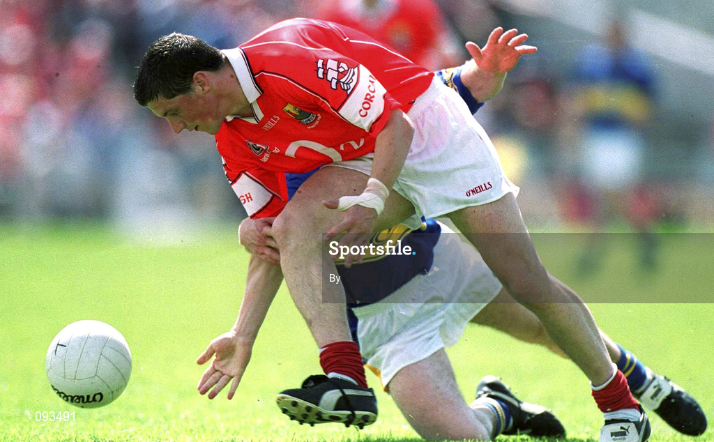 14 July 2002; Fionan Murray, Cork, is tackled by Tipperary's Bernard Hahessy. Cork v Tipperary, Bank of Ireland Munster Senior Football Final, Semple Stadium, Thurles, Co. Tipperary. Picture credit; Brendan Moran / SPORTSFILE