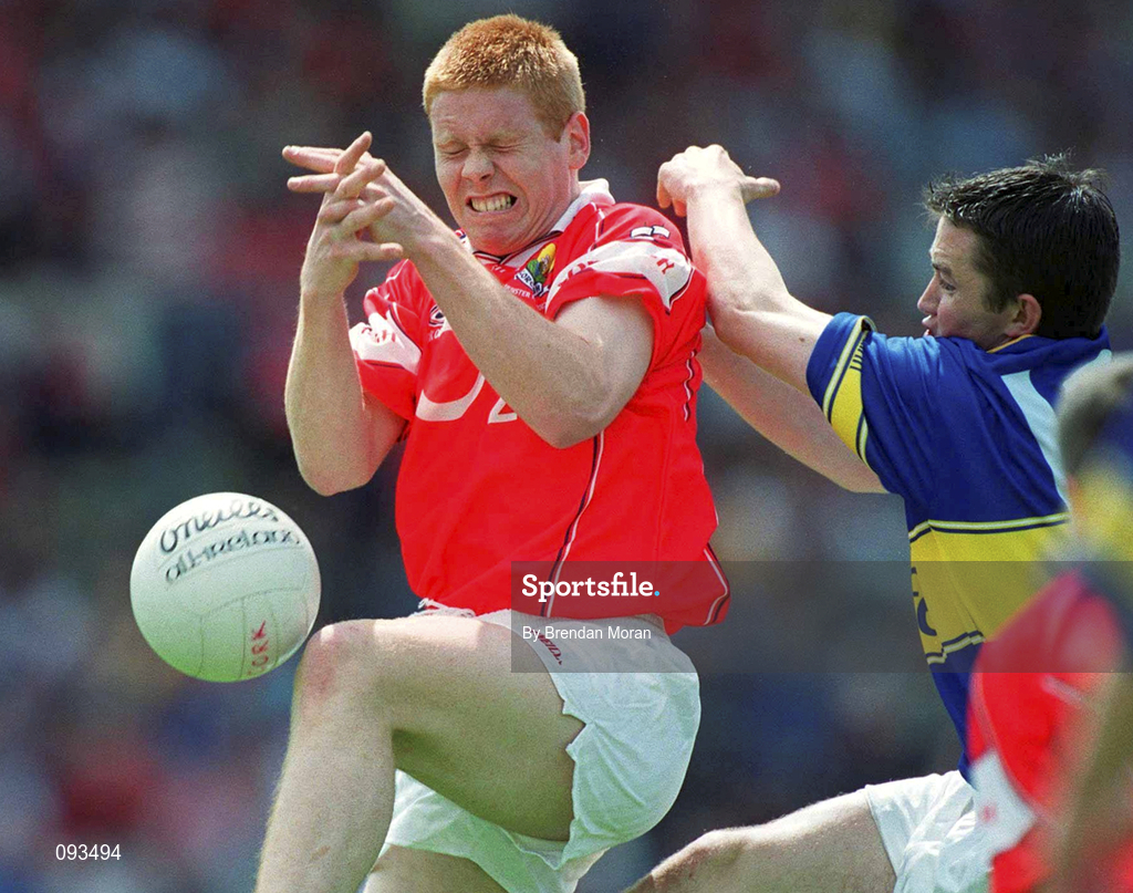 14 July 2002; Sean Levis of Cork is tackled by Damien O'Brien of Tipperary during the Bank of Ireland Munster Senior Football Final match between Tipperary and Cork at Semple Stadium in Thurles, Tipperary. Photo by Brendan Moran/Sportsfile