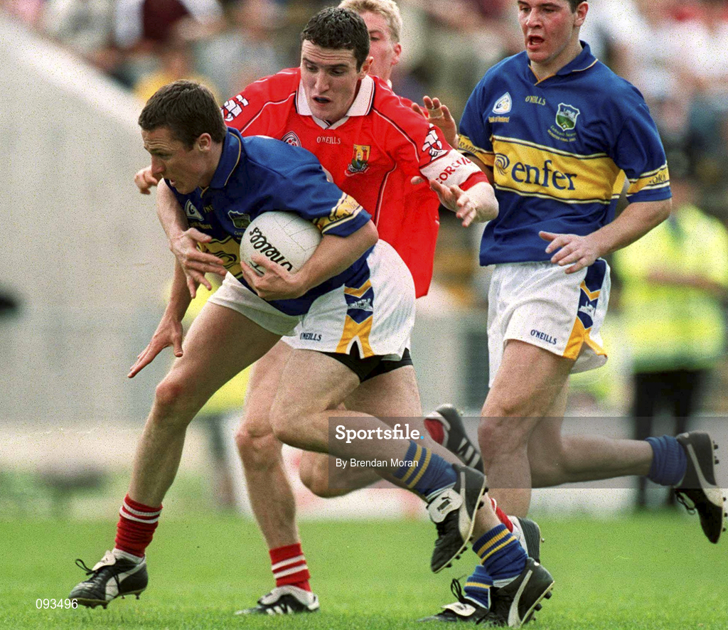 14 July 2002; Declan Browne of Tipperary is tackled by Graham Canty of Cork during the Bank of Ireland Munster Football Final match between Cork and Tipperary at Semple Stadium in Thurles, Tipperary. Photo by Brendan Moran/Sportsfile