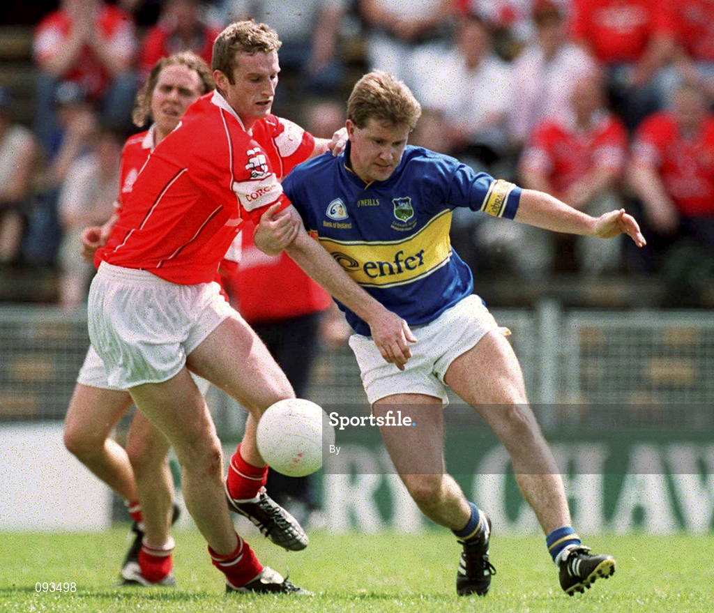 14 July 2002; Peter Lambert, Tipperary, is tackled by Nicholas Murphy, Cork. Bank of Ireland Munster Football Final, Cork v Tipperary, Semple Stadium, Thurles, Co. Tipperary. Picture credit; Brendan Moran / SPORTSFILE