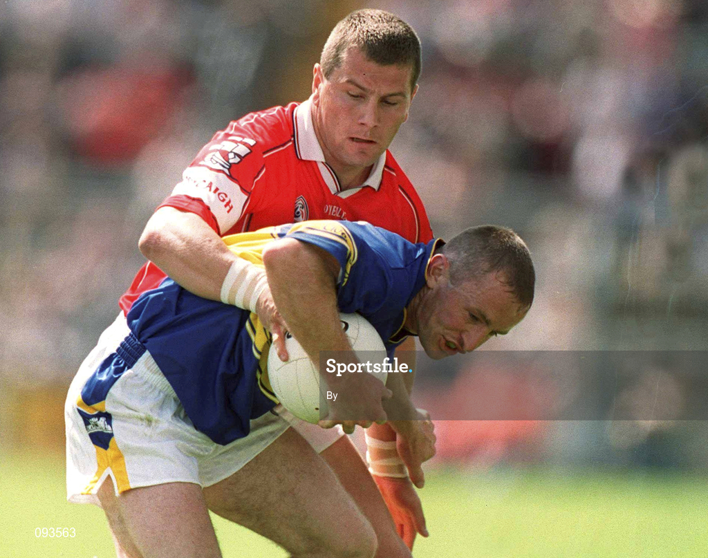 14 July 2002; Bernard Hahessy, Tipperary, is tackled by Diarmuid O'Sullivan, Cork. Bank of Ireland Munster Football Final, Cork v Tipperary, Semple Stadium, Thurles, Co. Tipperary. Picture credit; Brendan Moran / SPORTSFILE