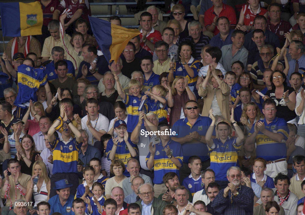 14 July 2002; Tipperary fans cheer  on their side against Cork. Bank of Ireland Munster Football Final, Cork v Tipperary, Semple Stadium, Thurles, Co. Tipperary. Picture credit; Brendan Moran / SPORTSFILE