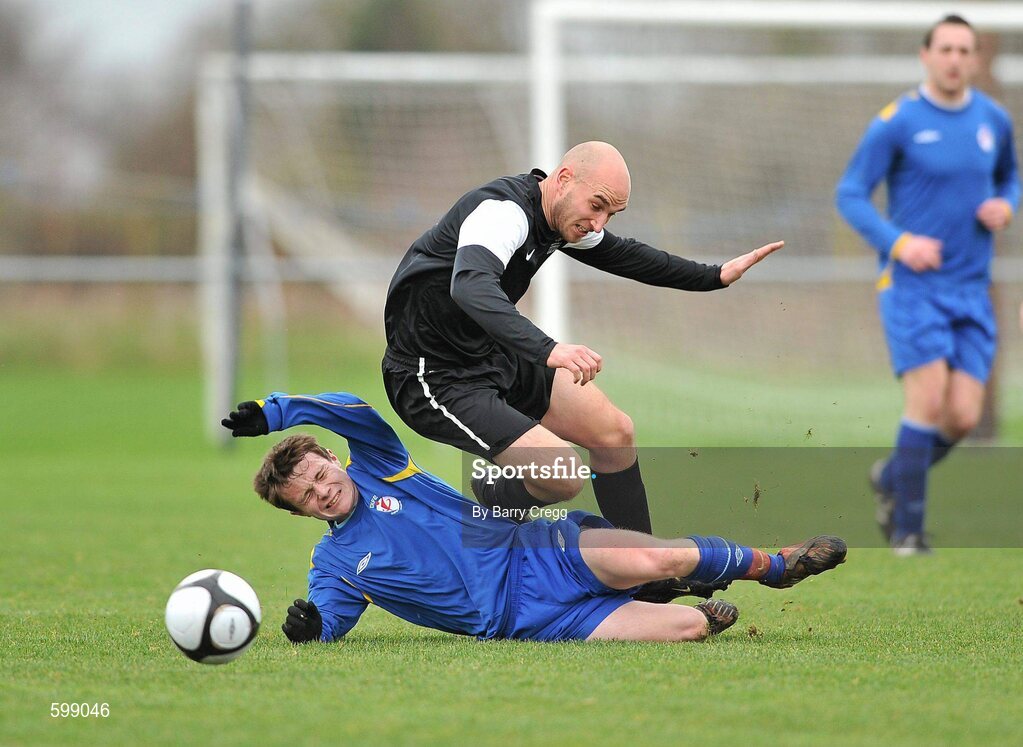 28 February 2012; Stephen McDonnell, Drogheda Institute of FE,slide tackles Colm Barron, IT Carlow 'C'. Umbro CUFL Division Two Final, Drogheda Institute of FE v IT Carlow 'C', Greenogue, Peamount United FC, Peamount, Dublin. Picture credit: Barry Cregg / SPORTSFILE