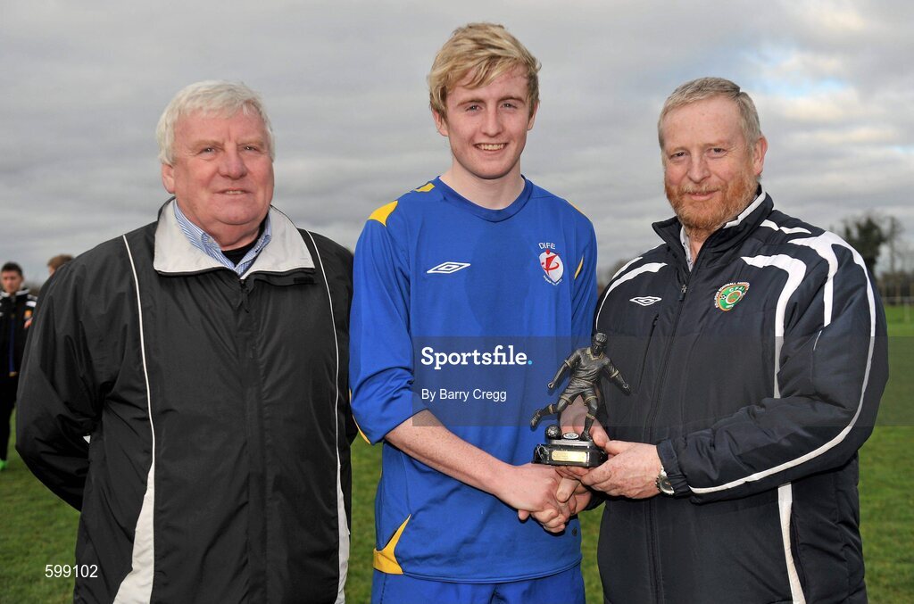 28 February 2012; Cormac Renaghan, IT Drogheda Institute of FE, is presented with the Man of the Match award by IUFU Chairman Terry McAuley, left, and CFAI Chairman Padraig Carney, right, after the game. Umbro CUFL Division Two Final, Drogheda Institute of FE v IT Carlow 'C', Greenogue, Peamount United FC, Peamount, Dublin. Picture credit: Barry Cregg / SPORTSFILE