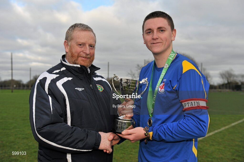 28 February 2012; IT Drogheda Institute of FE captain Garreth Toal is presented with the Division 2 cup by CFAI Chairman Padraig Carney after the game. Umbro CUFL Division Two Final, Drogheda Institute of FE v IT Carlow 'C', Greenogue, Peamount United FC, Peamount, Dublin. Picture credit: Barry Cregg / SPORTSFILE
