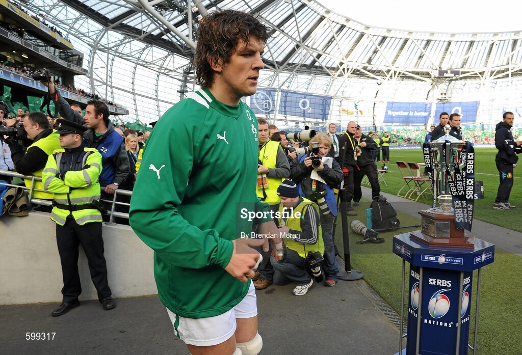 25 February 2012; Ireland's Donncha O'Callaghan passes the RBS Six Nations Championship trophy as he makes his way onto the pitch before the game. RBS Six Nations Rugby Championship, Ireland v Italy, Aviva Stadium, Lansdowne Road, Dublin. Picture credit: Brendan Moran / SPORTSFILE