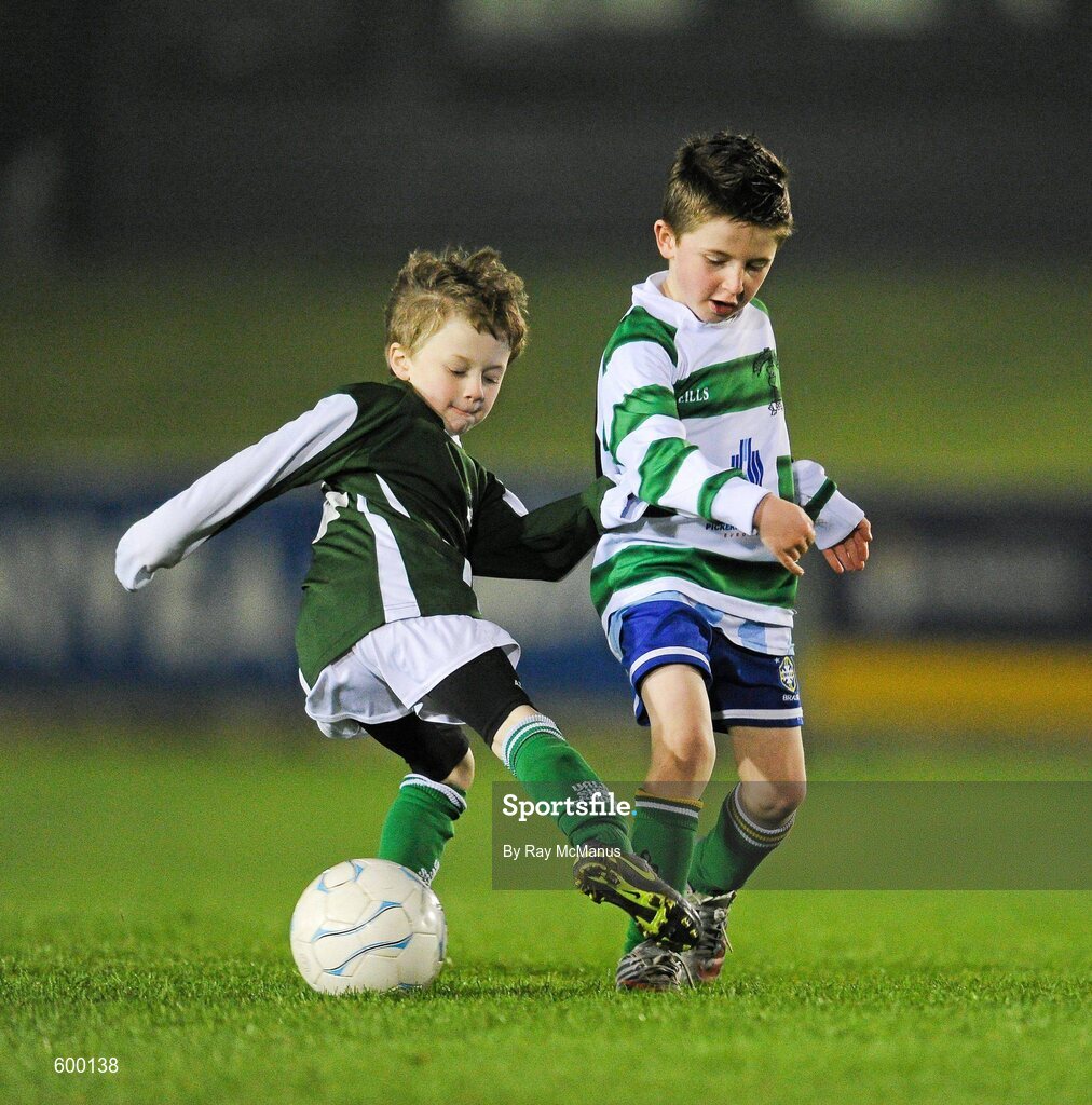2 March 2012; Ronan Langan, left, of the Shankhill Under 8 C1 team, is tackled by Jake McShane, of the Shankhill U8 A1 team, who entertained the spectators during the half-time break. Airtricity League Premier Division, UCD v Cork City, Belfield Bowl, UCD, Belfield, Dublin. Picture credit: Ray McManus / SPORTSFILE