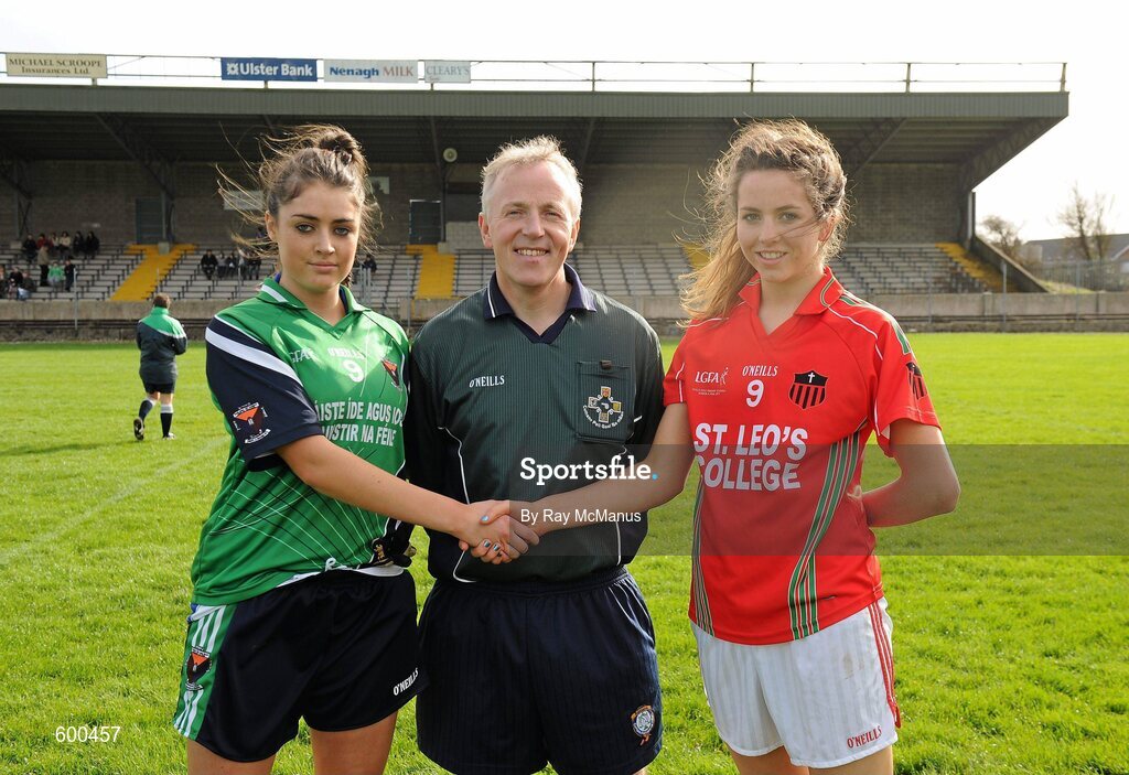 3 March 2012; The Colaiste Ide agus Iosef captain, Laura Sheeran, left, shakes hands with the St Leo’s captain, Jane Moore, across referee Michael Duffy. Tesco All-Ireland Post Primary Schools Senior A Semi-Final, St Leo’s, Carlow v Colaiste Ide agus Iosef, Limerick, McDonagh Park, Nenagh, Co. Tipperary. Picture credit: Ray McManus / SPORTSFILE