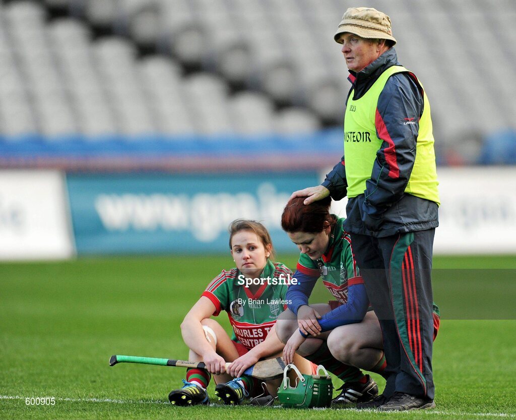 4 March 2012; Drom/Inch manager Johnny Harkin consoles Rosie Kenneally and Deirdre Dunne, left, after the match. All Ireland Senior Camogie Club Championship Final 2011, Drom/Inch, Tipperary v Oulart-the-Ballagh, Wexford, Croke Park, Dublin. Picture credit: Brian Lawless / SPORTSFILE