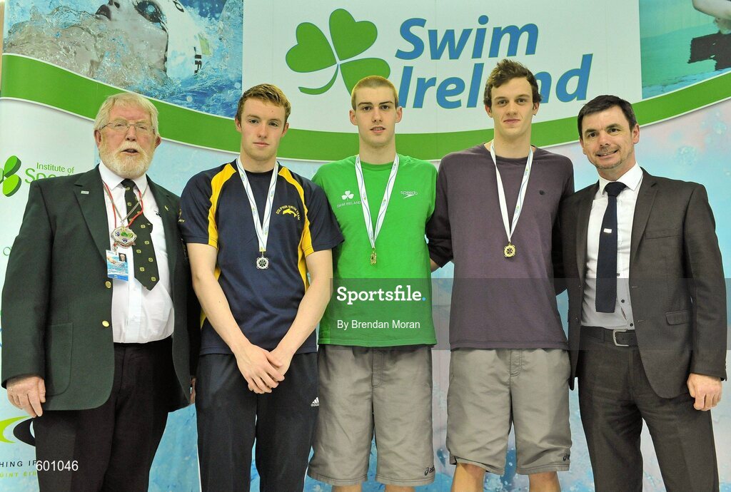 2 March 2012; Medallists in the Men's 100m breaststroke, from left, Johnny P Quinn, silver, Dolphin SC, Nicholas Quinn, gold, Castlebar SC, and Dan Sweeney, bronze, Sunday's Well SC, with Wally Clarke, left, President, Swim Ireland and Gary Keegan, Irish Institute of Sport, during the Irish Long Course National Swimming Championships/Olympic Trials. National Aquatic Centre, Abbotstown, Dublin. Picture credit: Brendan Moran / SPORTSFILE