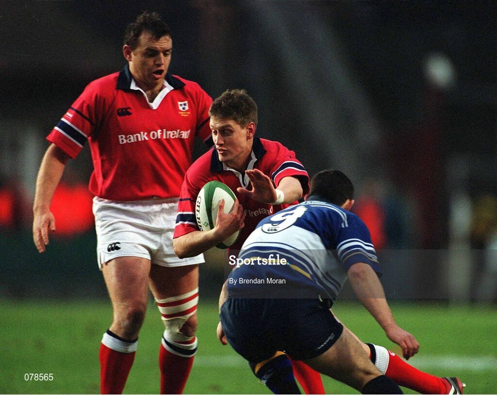 15 December 2001; Munster's Ronan O'Gara, is tackled by Leinster's Brian O'Meara. Leinster v Munster, Celtic League, Final, Lansdowne Road, Dublin. Rugby. Picture credit; Brendan Moran / SPORTSFILE