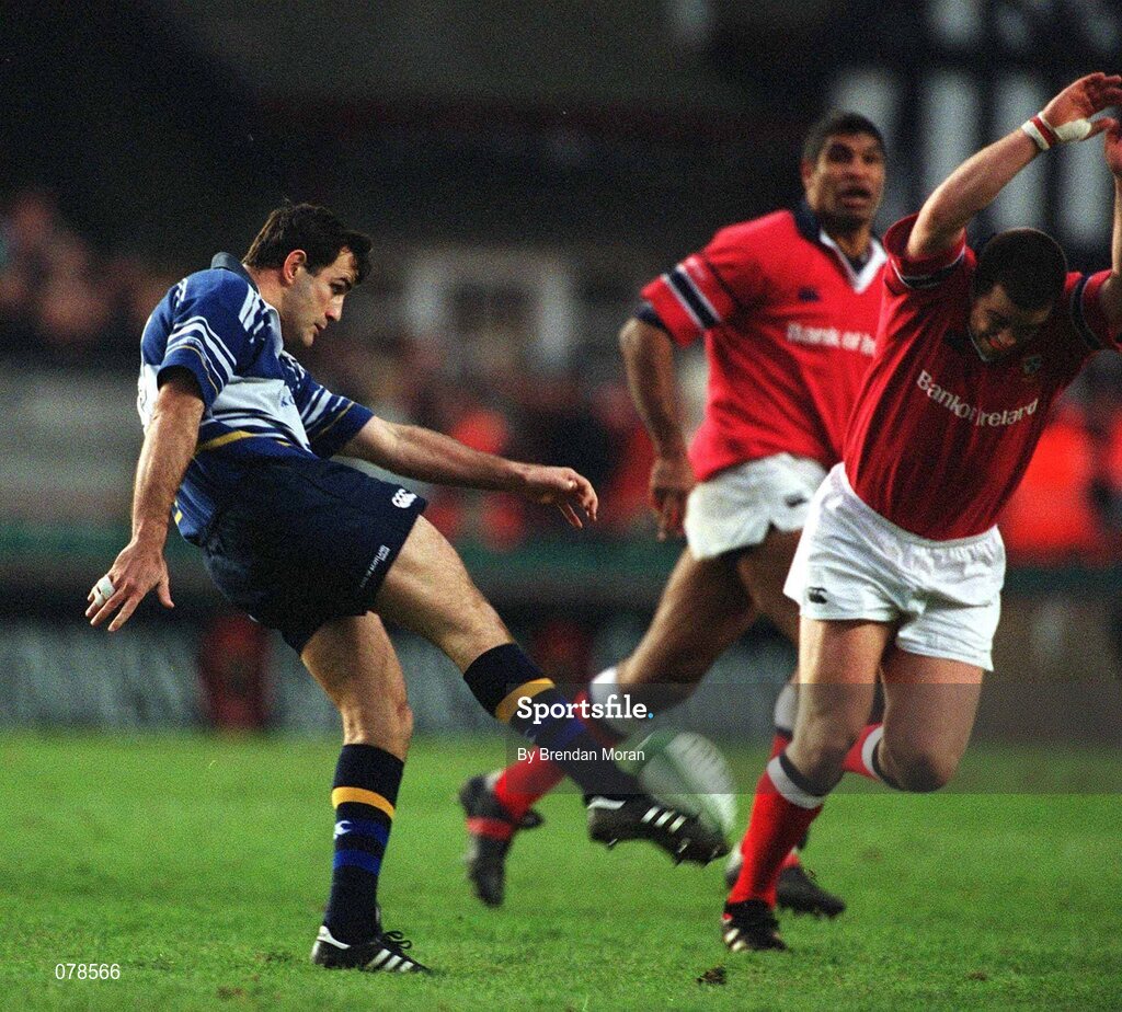 15 December 2001; Nathan Spooner, Leinster, gets his kick in despite the attention of Munster's Marcus Horan. Leinster v Munster, Celtic League, Final, Lansdowne Road, Dublin. Rugby. Picture credit; Brendan Moran / SPORTSFILE