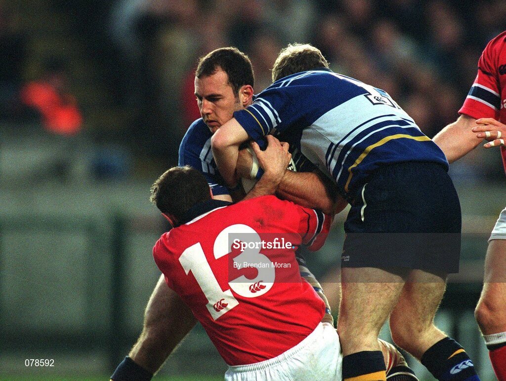 15 December 2001; Girvan Dempsey, Leinster, supported by team-mate Gordon D'Arcy (11), is tackled by Munster's Rob Henderson. Leinster v Munster, Celtic League, Final, Lansdowne Road, Dublin. Rugby. Picture credit; Brendan Moran / SPORTSFILE