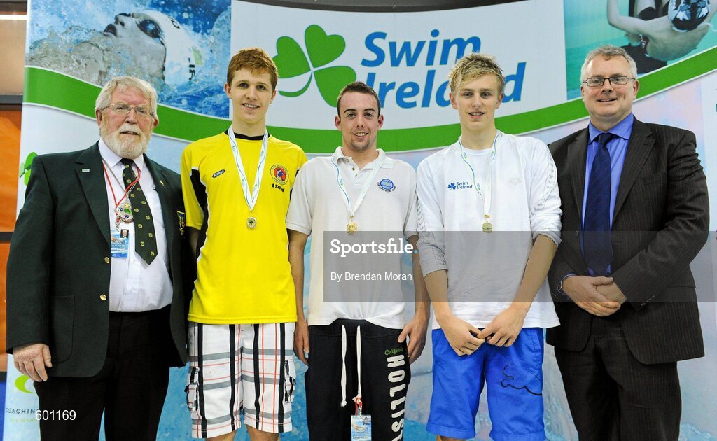 2 March 2012; Medallists in the Men's 200m Backstroke, from left, Jack Cobain, silver, Portmarnock SC, William Ensor, gold, ESB SC, and Mark Keaveney, bronze, Trojan SC, with Wally Clarke, left, President, Swim Ireland, and, during the Irish Long Course National Swimming Championships/Olympic Trials. National Aquatic Centre, Abbotstown, Dublin. Picture credit: Brendan Moran / SPORTSFILE