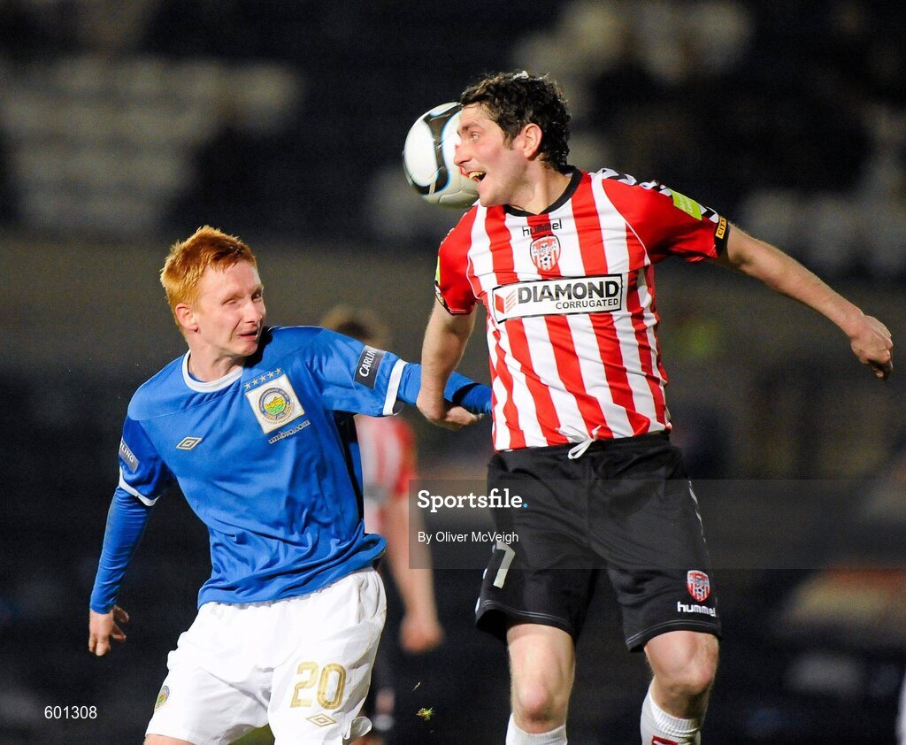5 March 2012; Robert Garrett, Linfield, in action against Ruaidhri Higgins, Derry City. 2012 Setanta Sports Cup, Quarter-Final, 1st Leg, Linfield v Derry City, Windsor Park, Belfast, Co. Antrim. Picture credit: Oliver McVeigh / SPORTSFILE