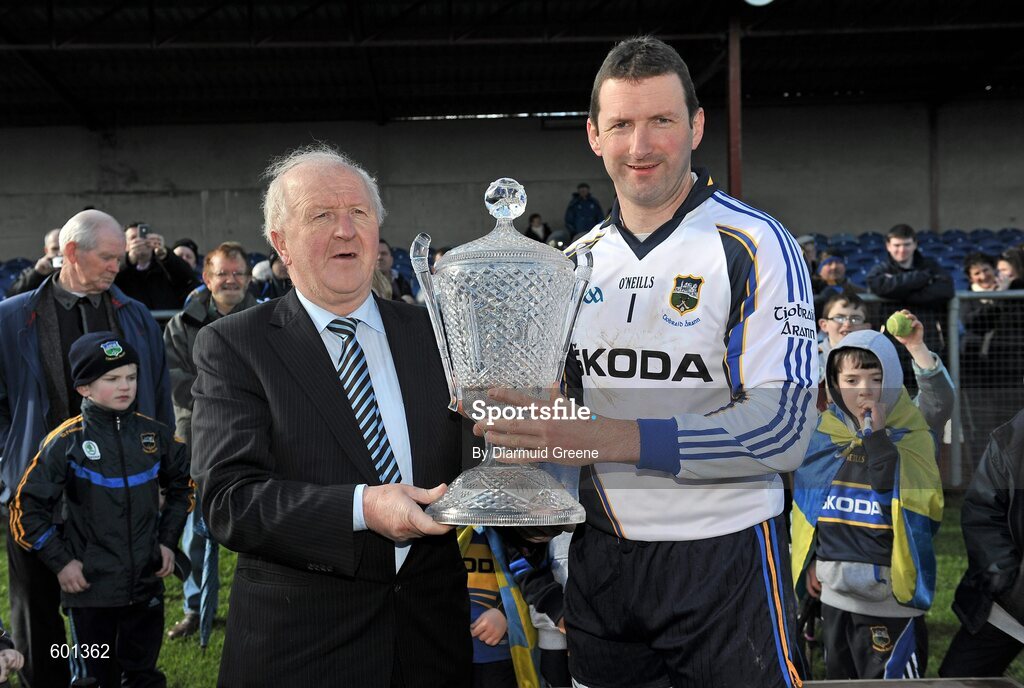 4 March 2012; Tipperary captain Brendan Cummins is presented with the cup by Robert Frost, Vice Chairman of the Munster Council. Waterford Crystal Cup Hurling Final, Clare v Tipperary, O'Garney Park, Sixmilebridge, Co. Clare. Picture credit: Diarmuid Greene / SPORTSFILE