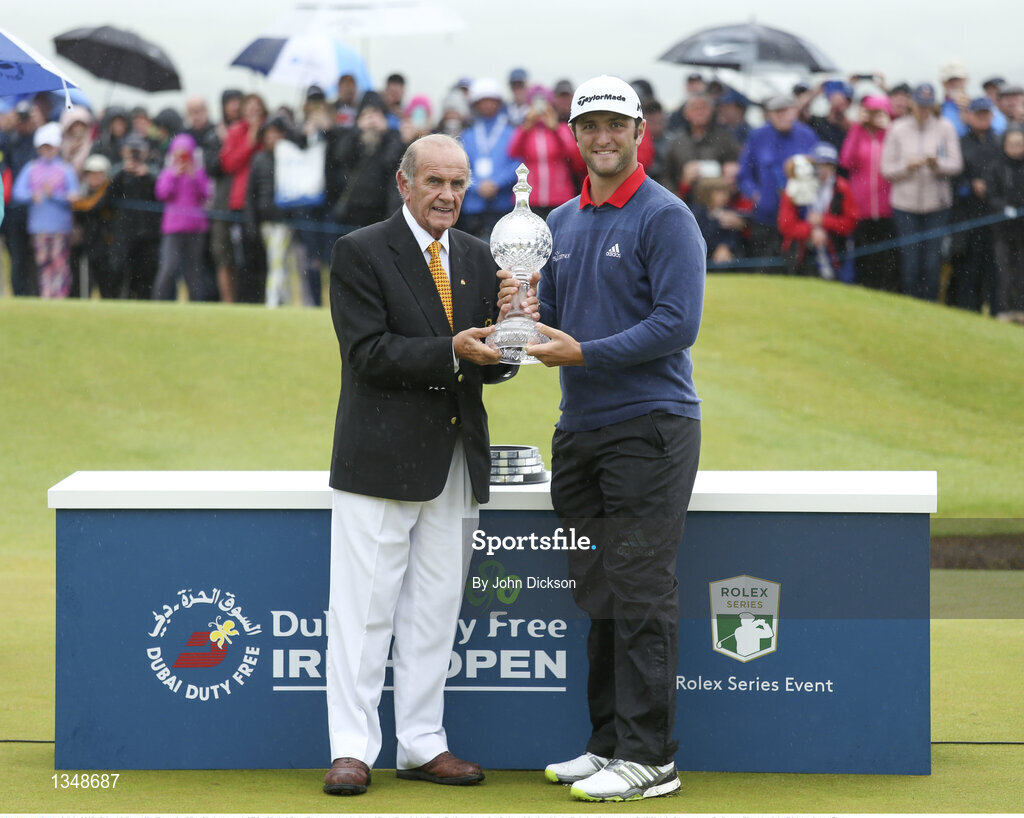 9 July 2017; Colm McLoughlin, Executive Vice Chairman and CEO of Dubai Duty Free presents the Dubai Duty Free Irish Open Golf trophy to Jon Rahm of Spain with the Dubai at Portstewart Golf Club in Portstewart, Co Derry. Photo by John Dickson/Sportsfile