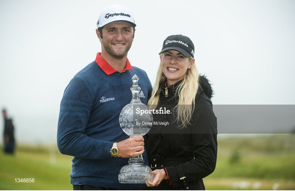 9 July 2017; Jon Rahm of Spain and girlfriend Kelley Cahill with the Dubai Duty Free Irish Open trophy on the 18th green on Day 4 of the Dubai Duty Free Irish Open Golf Championship at Portstewart Golf Club in Portstewart, Co Derry. Photo by Oliver McVeigh/Sportsfile