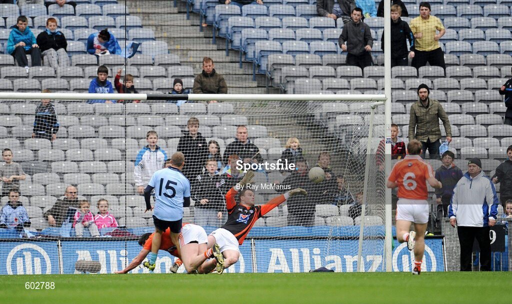 11 March 2012; Tomas Quinn shoots past John Kinghram and the Armagh goalkeeper Philip McEvoy to score the second Dublin goal. Allianz Football League Division 1, Round 4, Dublin v Armagh, Croke Park, Dublin. Picture credit: Ray McManus / SPORTSFILE