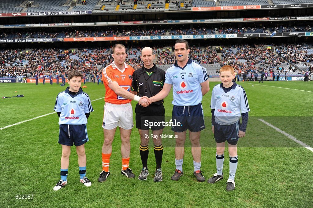 11 March 2012; Dublin mascotts John Foley, left, and Fiachra Potts, both members of the Na Fianna club, join referee Michael Collins and the two captains, Ger Brennan, Dublin, and Kieran McKeever, Armagh, before the start of the game. Allianz Football League Division 1, Round 4, Dublin v Armagh, Croke Park, Dublin. Picture credit: Ray McManus / SPORTSFILE