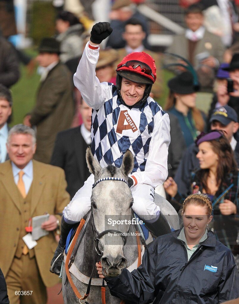 14 March 2012; Barry Geraghty, aboard Simonsig, celebrates winning the Neptune Investment Management Novices' Hurdle. Cheltenham Racing Festival, Prestbury Park, Cheltenham, England. Picture credit: Brendan Moran / SPORTSFILE