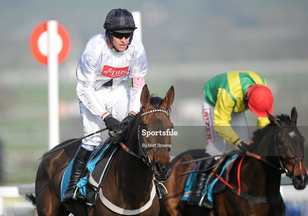 14 March 2012; Finian's Rainbow, with Barry Geraghty up, left, on the way to winning the sportingbet.com Queen Mother Champion Steeple Chasee from second place Sizing Europe, with Andrew Lynch up. Cheltenham Racing Festival, Prestbury Park, Cheltenham, England. Picture credit: Matt Browne / SPORTSFILE