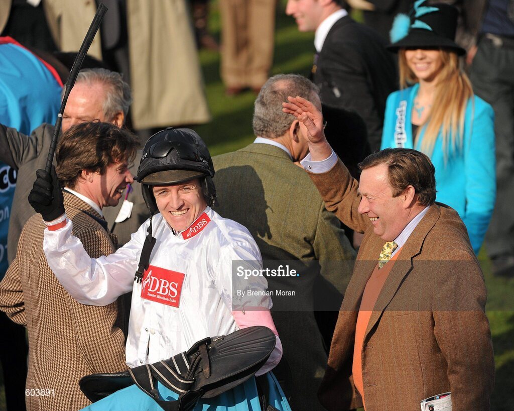14 March 2012; Jockey Barry Geraghty and trainer Nicky Henderson acknowledge the crowd's applause after Finian's Rainbow won the sportingbet.com Queen Mother Champion Steeple Chase. Cheltenham Racing Festival, Prestbury Park, Cheltenham, England. Picture credit: Brendan Moran / SPORTSFILE