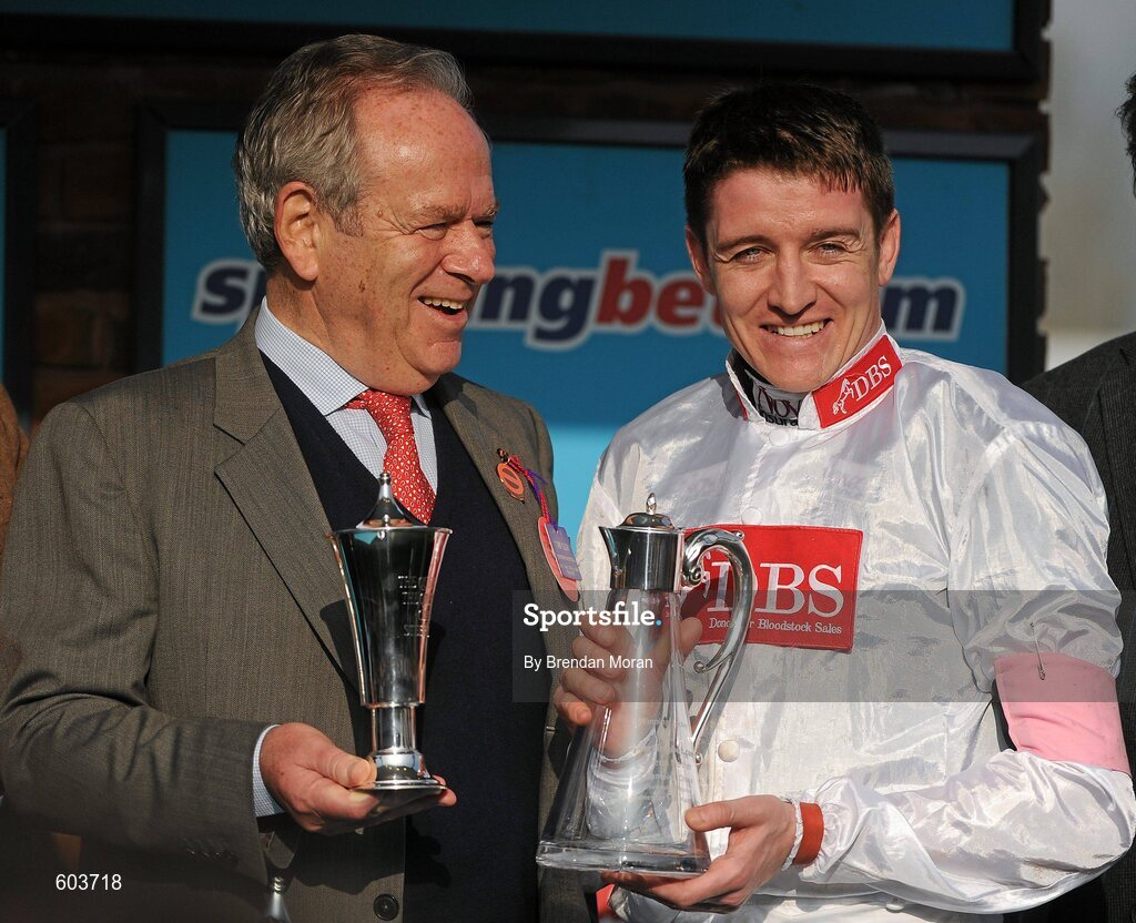 14 March 2012; Jockey Barry Geraghty with winning owner Michael Buckley after Finian's Rainbow won the sportingbet.com Queen Mother Champion Steeple Chase. Cheltenham Racing Festival, Prestbury Park, Cheltenham, England. Picture credit: Brendan Moran / SPORTSFILE