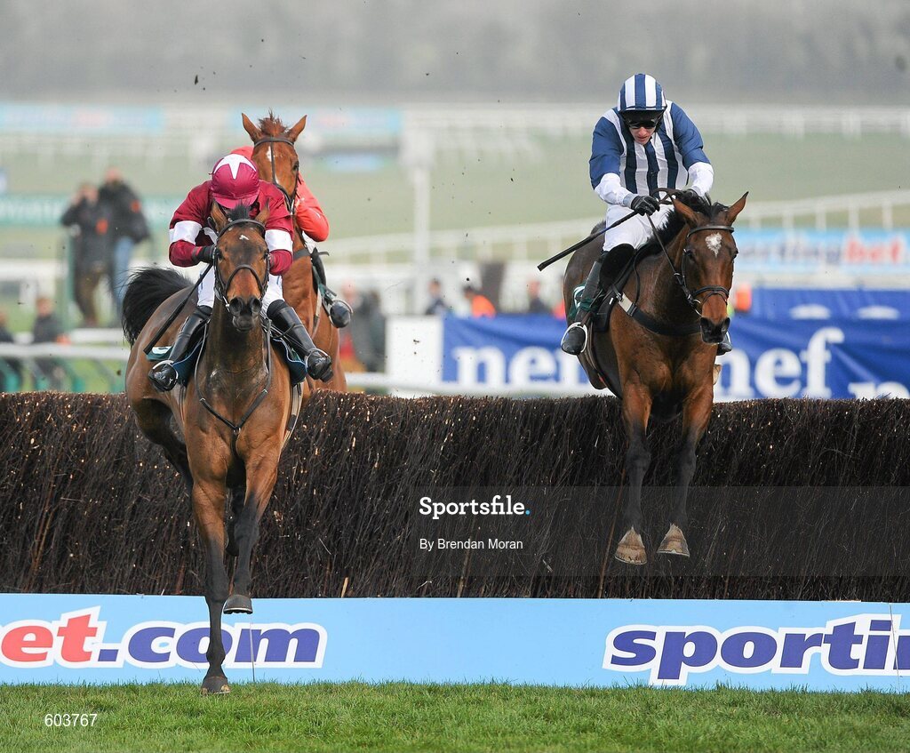 14 March 2012; Teaforthree, right, with John Thomas McNamara up, trails eventual third placed Four Commanders, with Nina Carberry up, over the last on their way to winning the Diamond Jubilee National Hunt Steeple Chase. Cheltenham Racing Festival, Prestbury Park, Cheltenham, England. Picture credit: Brendan Moran / SPORTSFILE
